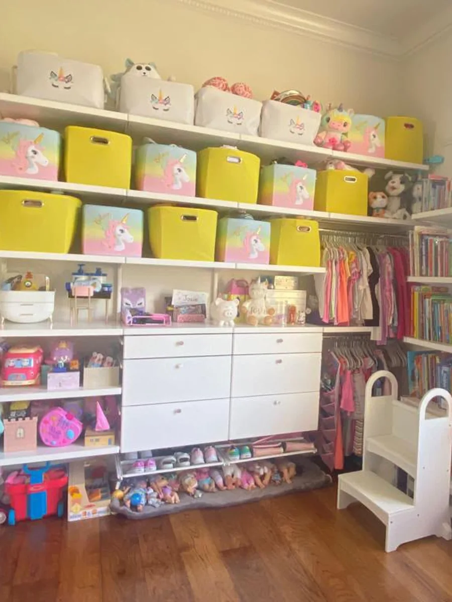 After: kids' closet with clean shelves, drawers and floor, bins and clothes back in place