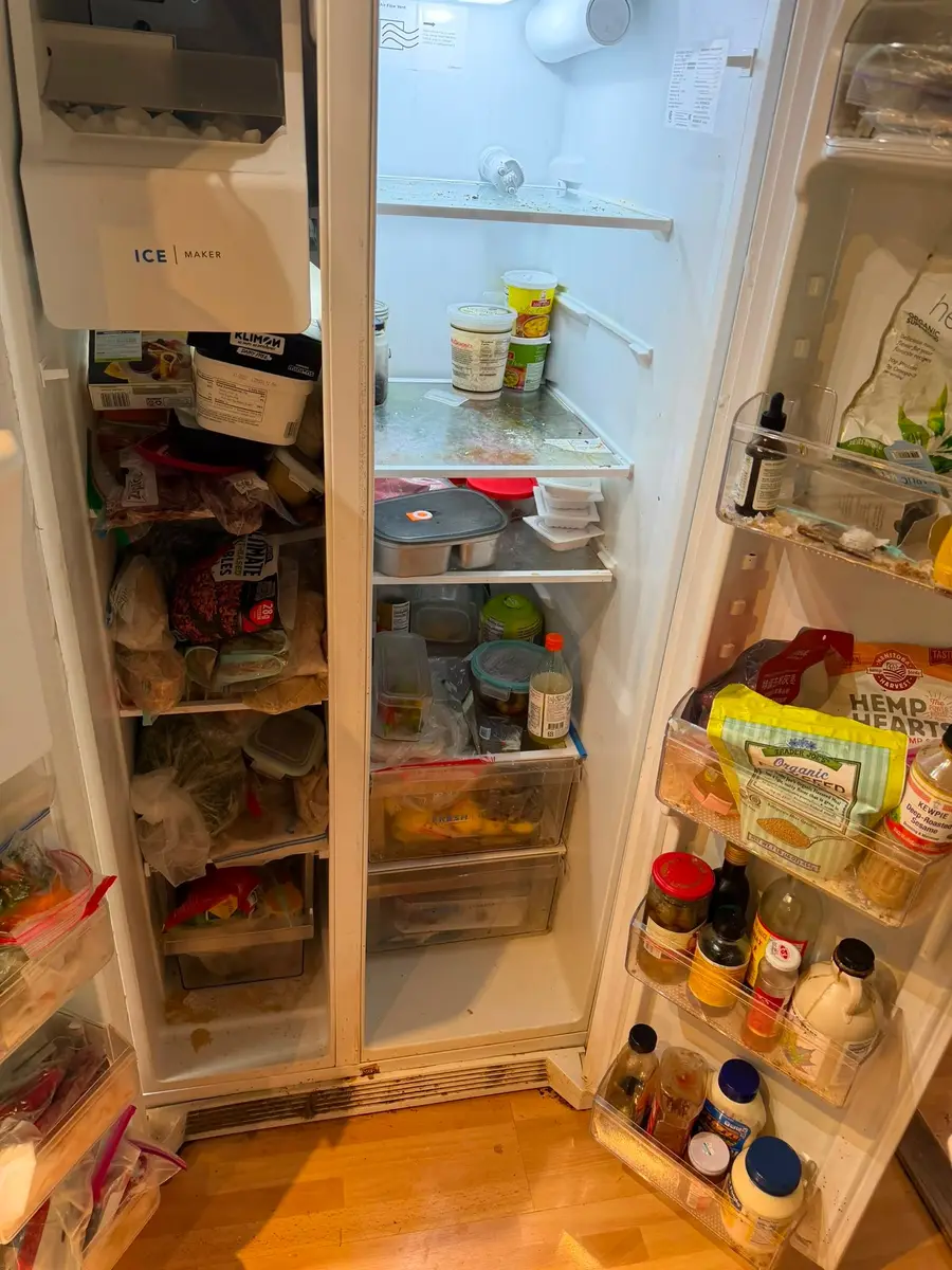 Before: refrigerator with spills on the shelves and dirty door bins