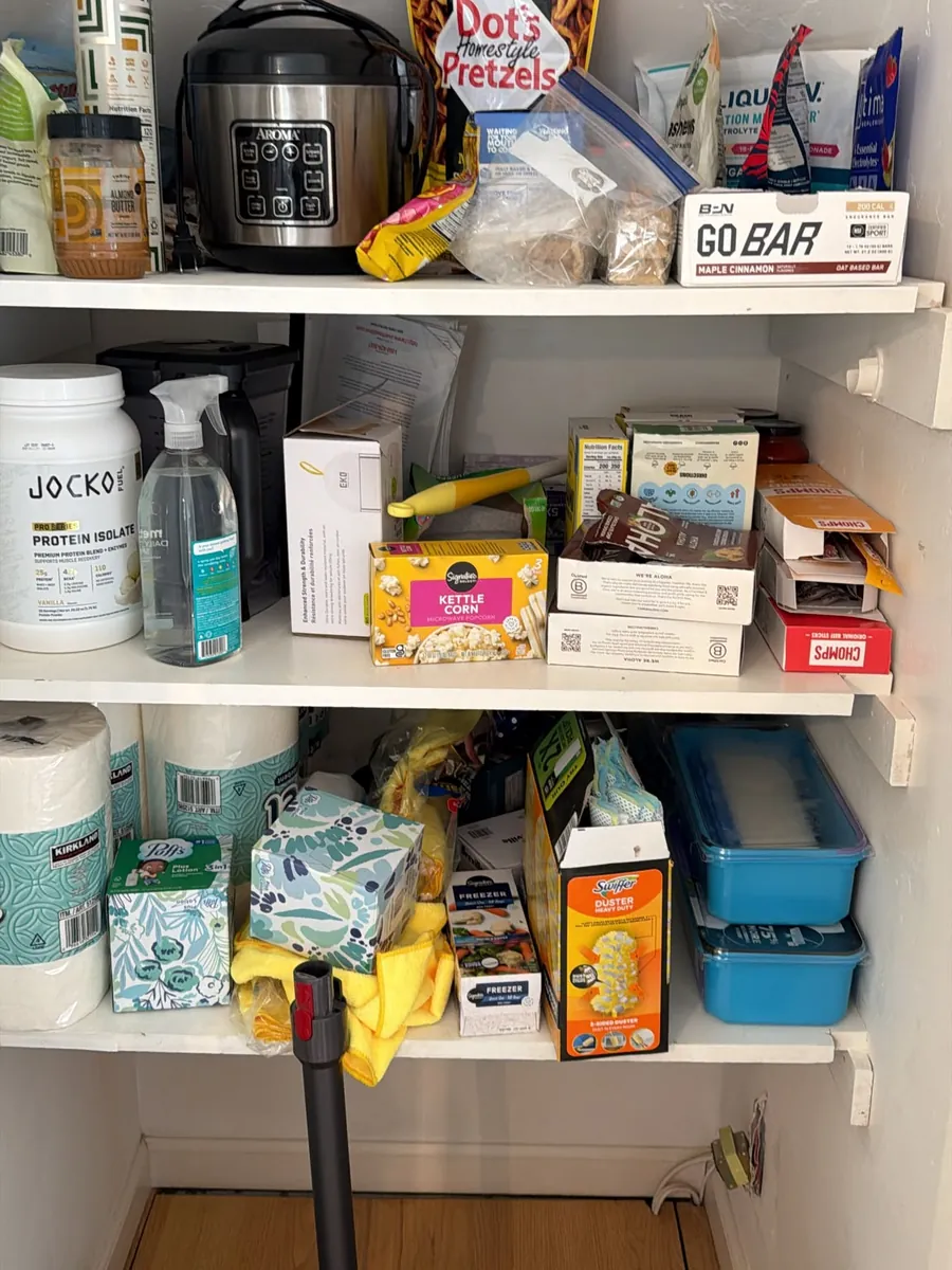 Before: crowded pantry shelves with boxes, snacks and cleaning supplies piled together