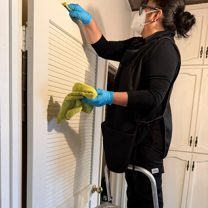 Cleaner scrubbing a bathroom during a deep cleaning